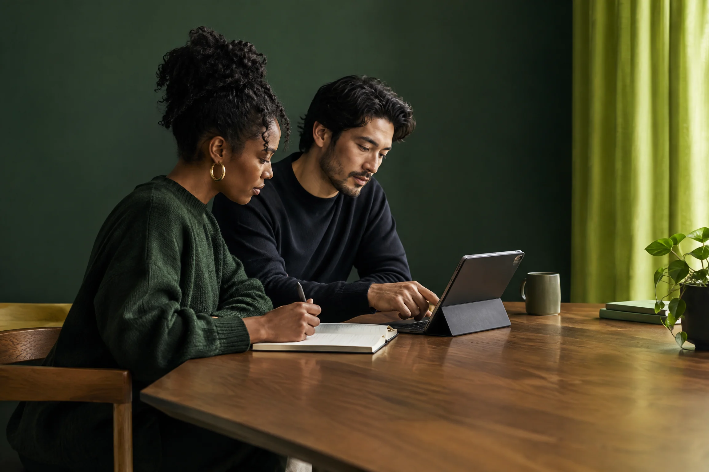 Two professionals reviewing a product on a table